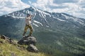 Professional photographer man taking photos and enjoy the view of mountains in Yellowstone National Park. Royalty Free Stock Photo