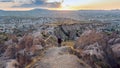 Professional photographer standing on mountain landscape of Cappadocia, Turkey Royalty Free Stock Photo