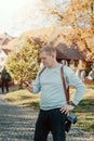 Professional Photographer Taking Picture Of Beautiful Autumn Park. Man Professional Photographer standing With Camera Royalty Free Stock Photo