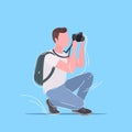 Professional photographer taking picture photo man traveler with backpack shooting with digital dslr camera male cartoon Royalty Free Stock Photo