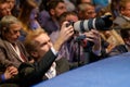 Professional photographer working at business conference