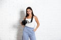 Professional photographer working near white wall in studio Royalty Free Stock Photo