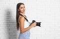 Professional photographer working near white  wall in studio Royalty Free Stock Photo