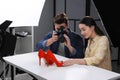 Professional photographers shooting stylish shoes