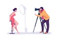 Professional photographers taking pictures. Man shooting photographs, woman posing. Model work. Photo studio with Royalty Free Stock Photo