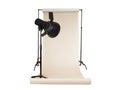 Professional photography studio setup with light, stand, and seamless backdrop Royalty Free Stock Photo