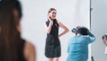 The professional photoshoot set indoor studio with Asian model actress, make up artist and photographer, behind the scene in Royalty Free Stock Photo