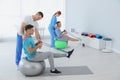 Professional physiotherapists working with patients Royalty Free Stock Photo