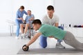 Professional physiotherapists working with patients Royalty Free Stock Photo