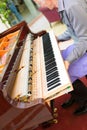 Professional piano technician removing keyboard for tuning repai Royalty Free Stock Photo