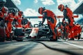 Professional pit crew team in action at car race pit stop, ultimate teamwork concept Royalty Free Stock Photo