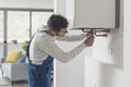 Professional plumber checking a boiler Royalty Free Stock Photo