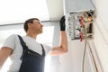 Professional plumber checking a boiler and pipes, boiler service concept Royalty Free Stock Photo