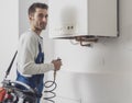 Professional plumber checking a boiler Royalty Free Stock Photo