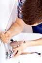 Professional plumber repairing a tap