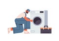 Professional plumber technician in uniform repairing washing machine repair service concept