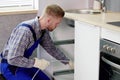 Professional Plumber Using Plunger to Unclog Drain: Cleaning Royalty Free Stock Photo