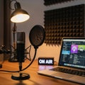 Professional podcast studio setup with microphone laptop and on air light for broadcasting Royalty Free Stock Photo