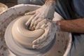 Professional potter making bowl in pottery workshop