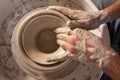 Professional potter making bowl in pottery workshop Royalty Free Stock Photo