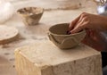 Professional potter making bowl in pottery workshop Royalty Free Stock Photo