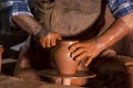 Professional potter making bowl in pottery workshop Royalty Free Stock Photo