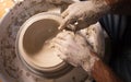 Professional potter making bowl in pottery workshop, studio Royalty Free Stock Photo