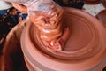 Professional potter making bowl in pottery workshop, studio