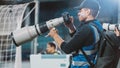 Professional Press Officer, Sports Photographers with Camera with Zoom Lens Shooting Football Royalty Free Stock Photo