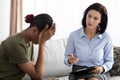 Professional Psychologist Lady Having Therapy Session With Depressed Black Female Soldier Royalty Free Stock Photo