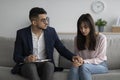 Professional psychotherapist comforting depressed arab female patient, sad middle eastern woman consulting psychologist Royalty Free Stock Photo