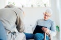 Professional psychotherapy. Male psychologist having session with male patient at mental health clinic, Taking Notes Royalty Free Stock Photo