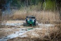 Professional quad biker rides fast on sand. Quad racing, ATV 4x4