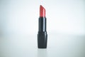 Professional red lipstick cosmetic product, white background