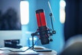 professional red microphone in the foreground, entertainment and communication concept Royalty Free Stock Photo