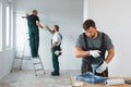 Renovation crew painting walls of new build apartment Royalty Free Stock Photo