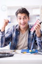 The professional repairman repairing computer in workshop Royalty Free Stock Photo