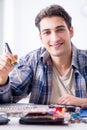 The professional repairman repairing computer in workshop Royalty Free Stock Photo