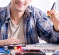 Professional repairman repairing computer in workshop Royalty Free Stock Photo