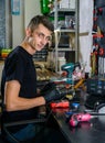 Professional repairman repairing computer in workshop