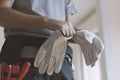 Professional repairman wearing protective gloves Royalty Free Stock Photo