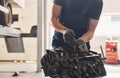 Professional repairman works with broken automobile engine