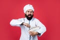 Professional restaurant bearded cook man hold beater, cooking with passion