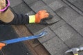 Professional Roofer at work on a residential projectr/