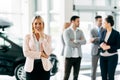 Professional saleswoman at dealership Royalty Free Stock Photo