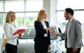 Professional saleswoman working in car dealership Royalty Free Stock Photo