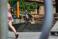 Professional scooter rider grinding down a rail in syndey Royalty Free Stock Photo