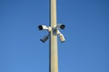 Professional Security cameras scanning the street in the city. Recording video with cam in 4K. CCTV camera on the pole. Concept: s Royalty Free Stock Photo