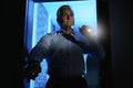 Professional security guard with flashlight checking room Royalty Free Stock Photo