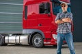 Professional Semi Truck Driver and His Heavy Duty Vehicle Royalty Free Stock Photo